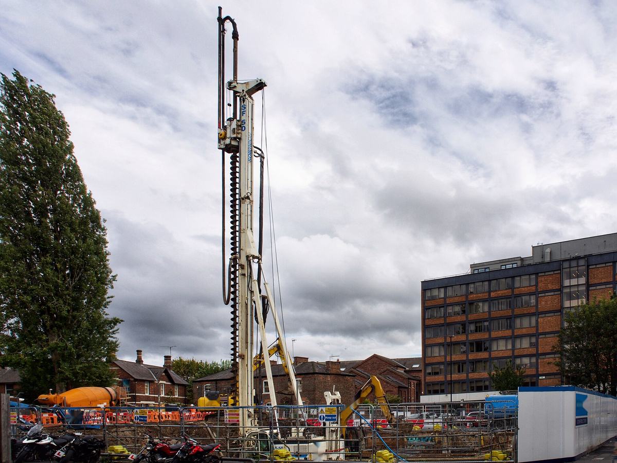 Continuous flight auger piling rig on an urban site