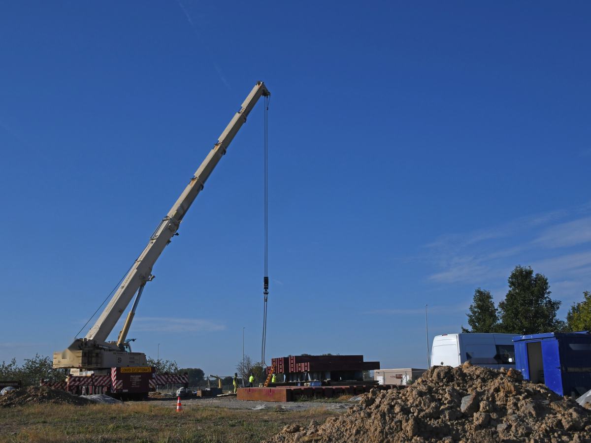 Crane lifting test weights for a static pile load test