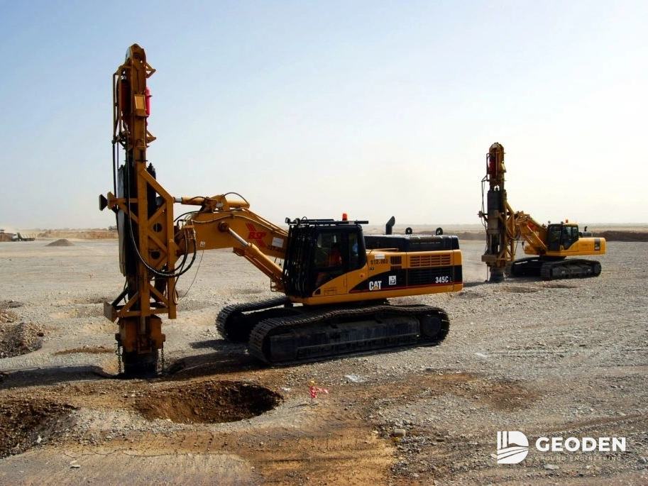 Two rapid impact compaction rigs working on a treatment area